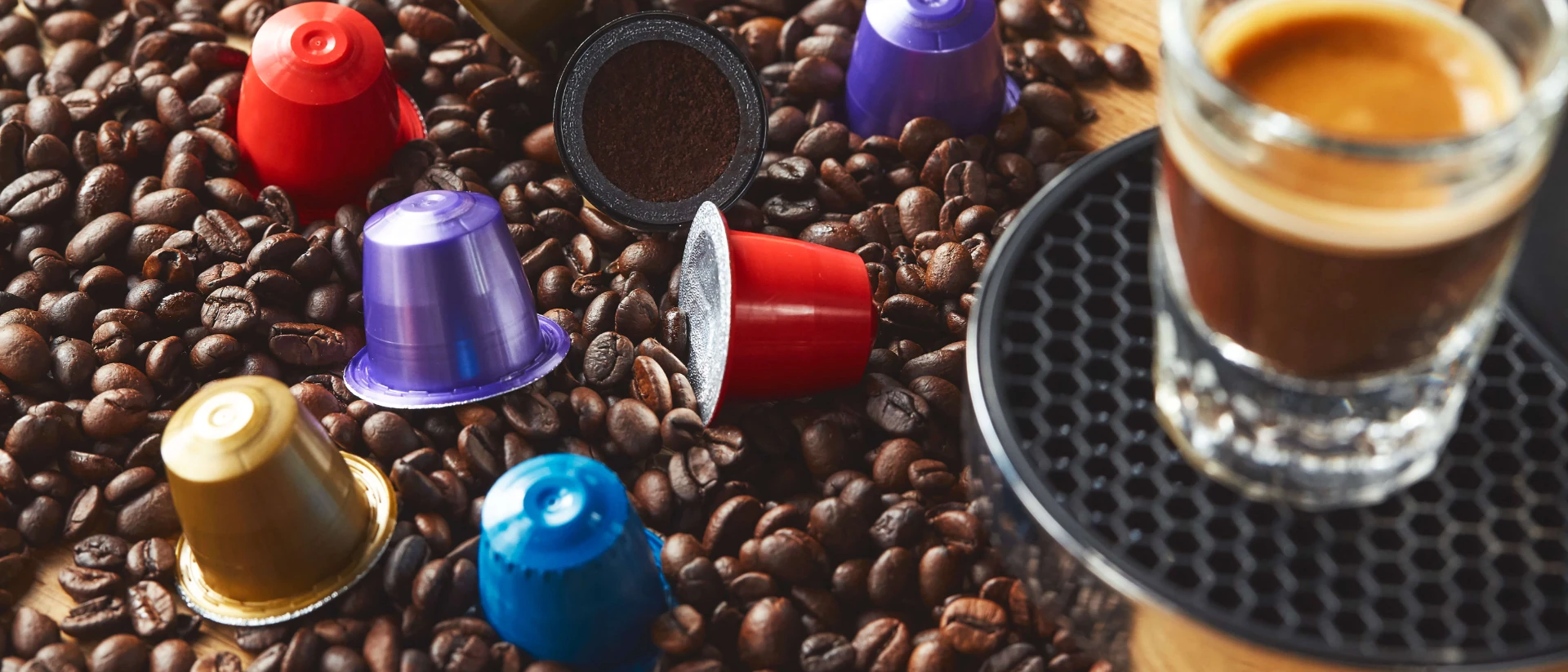 Cream pouring into black coffee